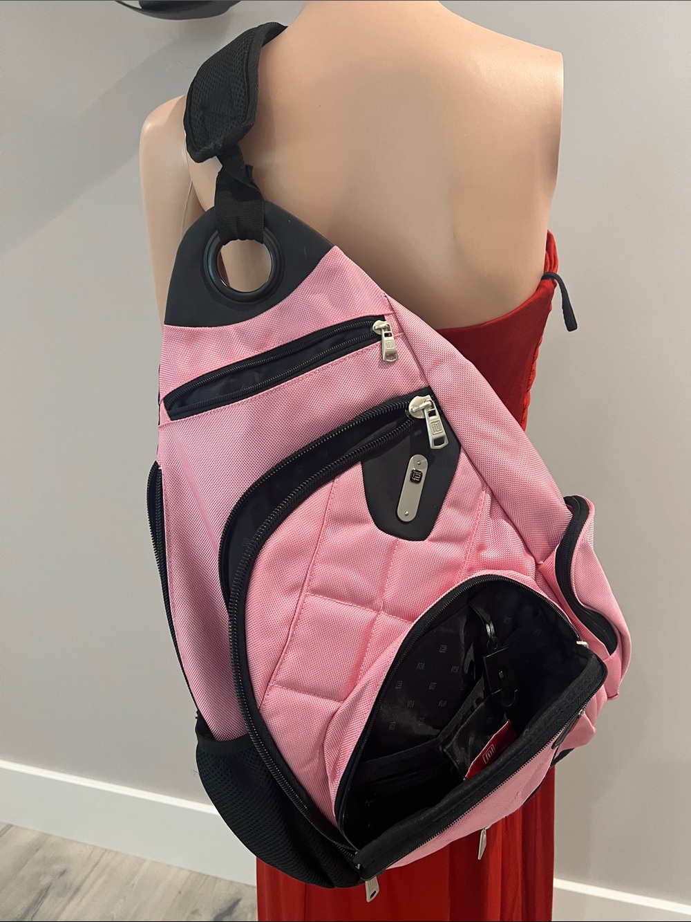 Women’s Pink Sling Backpack with Multiple Zip Pockets